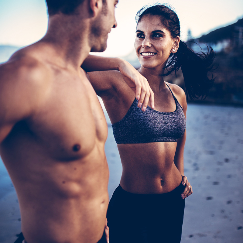 Fit couple on the beach