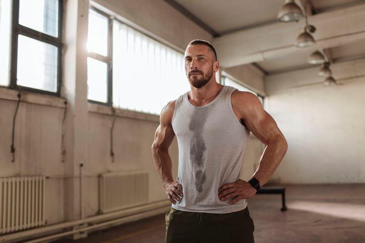 Man Standing In The Gym After A Workout Session