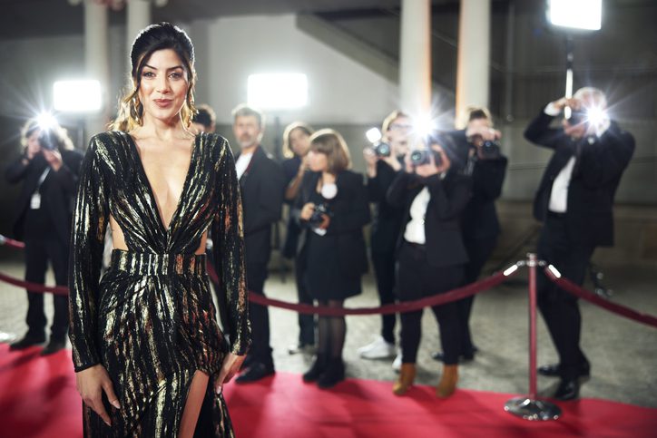 Smiling Female Celebrity Walking On Red Carpet